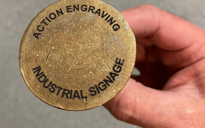 Engraved brass plug for concrete