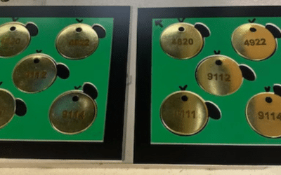 engraved brass circular tags with drilled holes